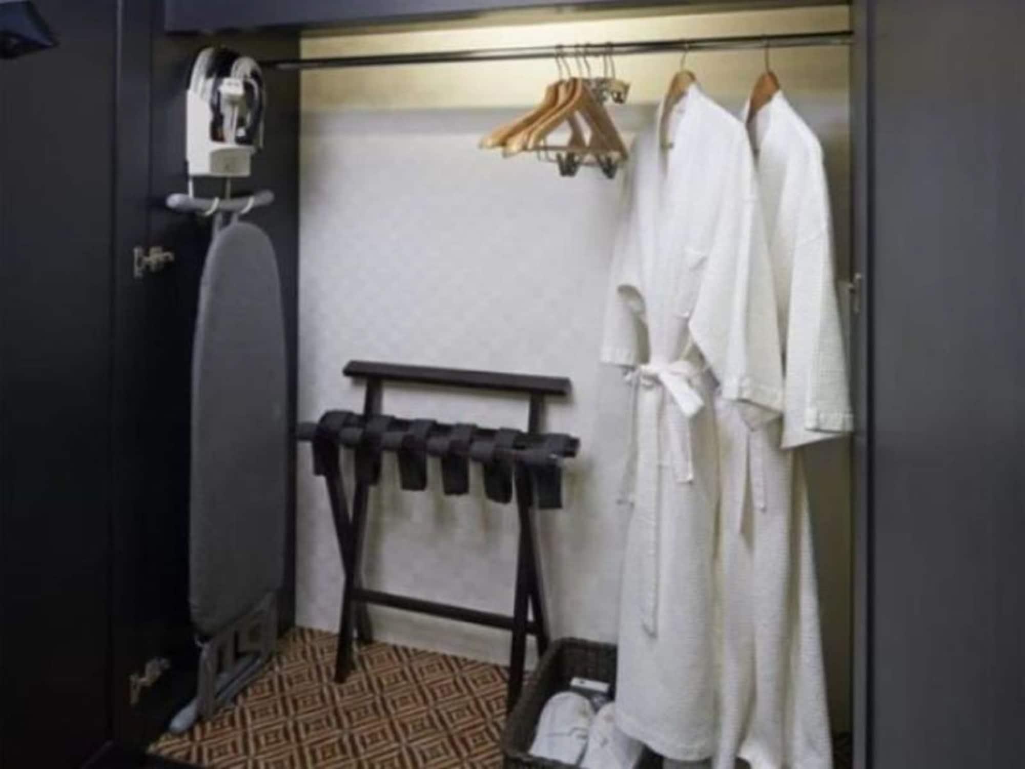 Grand Millennium Kuala Lumpur Hotell Eksteriør bilde A bathrobe hanging in a closet
